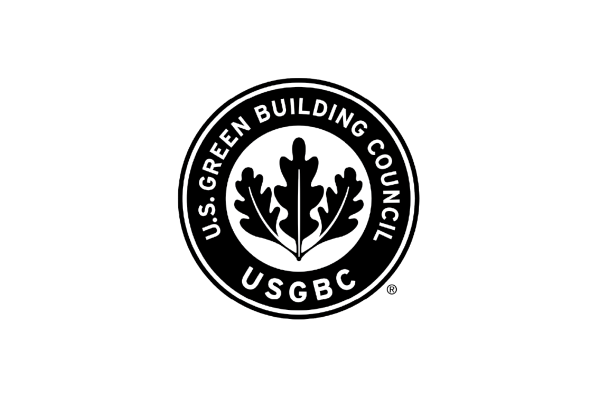 The logo of the U.S. Green Building Council features a circular design with a stylized oak leaf in the center. The text "U.S. GREEN BUILDING COUNCIL" is displayed around the top, and "USGBC" is at the bottom. The logo is presented on a black background